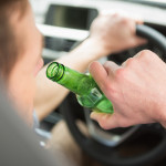 man drinking while driving